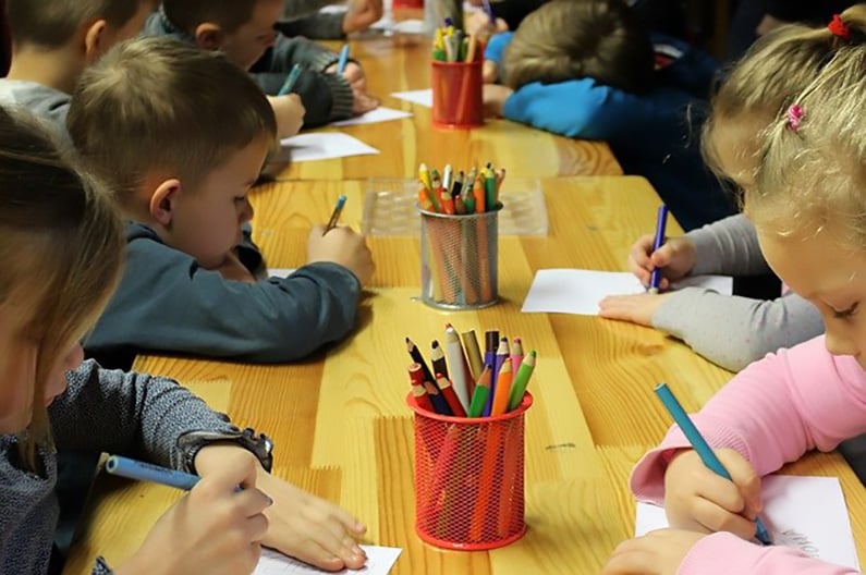 Children painting in kindergarten