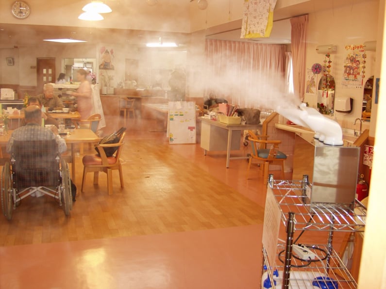 Spraying disinfectant in care facility